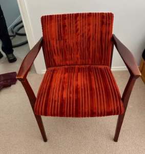 Single Arm Chair, dark wooden frame, tomato red velour material