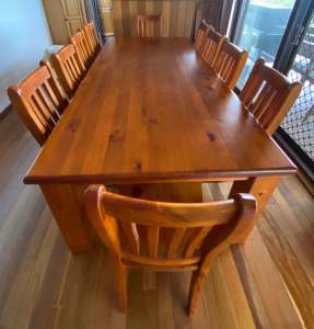 11 piece solid wood dining table and chairs.