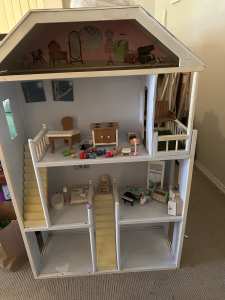Children’s wooden doll house and toys