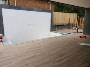 Tiler apprentice or qualified wall and floor tiler