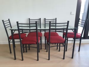 Glass top dinning table with six chairs