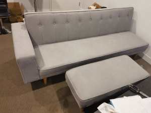 Gray fabric sofa bed with ottoman