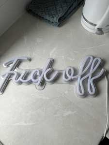 Offensive blue neon sign