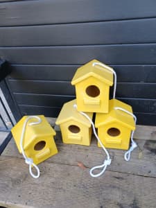 Hanging bird houses, yellow ceramic. $12.00 each