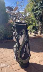 Golf bag with assortment of clubs