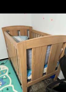 Baby cot and 2 mattresses 