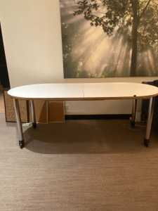 White laminate plywood table / work desk with wheels.