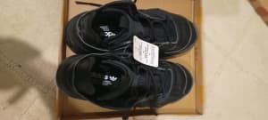 A brand new Adidas black leather shoes for sale 