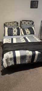 Double bed base with firm mattress, linen, pillows