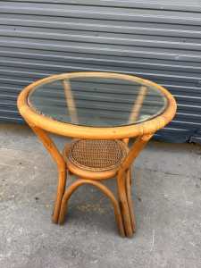 Small round cane side table with glass top $50