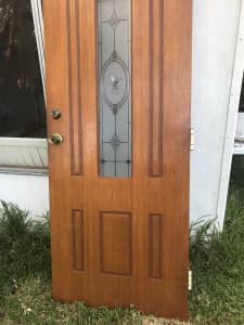 Wooden door with glass insert and keys
