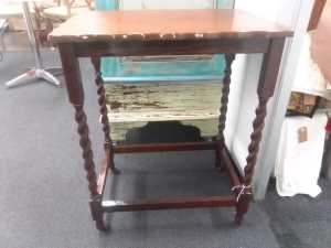 An antique mahogany drink trolley