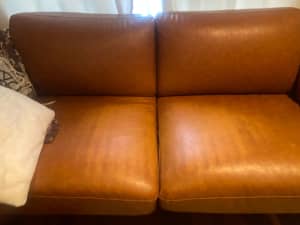 Two faux leather tan couches