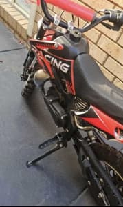 50cc red dirt bike (NEGOTIABLE)
