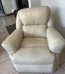 A single leather, high back armchair, cream colour