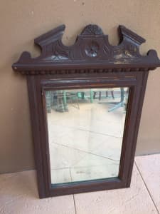 Mirror - bevelled, framed with carved wood. Very old, 1920s style. 