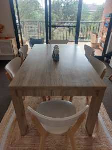 Wooden dinning table and 6 chairs .