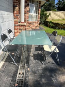 glass dinning table with 5 chairs moving sale