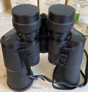 Binoculars . Tasco 10x-30 x 50mm Zoom. Rubber Armoured Binocular