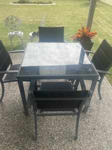 GLASS TABLE AND 4 CHAIRS