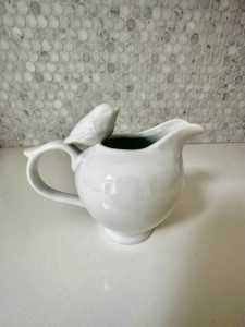 Small white jug with bird
