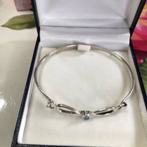 Gorgeous Sterling silver bracelet with small blue zirconia