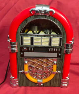a Radio Jukebox. a tabletop Cd/ AM Radio jukebox