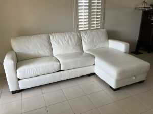 White leather lounge - with chaise and pull out bed