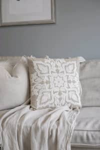 NEW cushion beige with white embroidered pattern