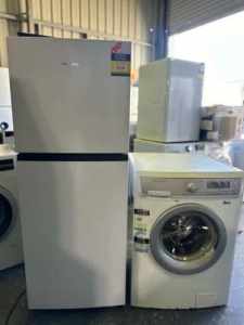 HISENSE 205 litres fridge freezer and Electrolux 7 kgs washing machine
