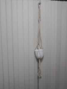 Macrame plant holder plus pot will hold a much larger pot