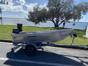 Quintrex 310 wasp Tinny, 9.9hp Tohatsu outboard, on trailer