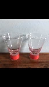 A pair of D & B shot glasses