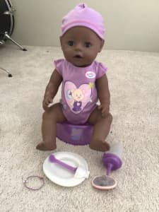 Baby Born doll with accessories
