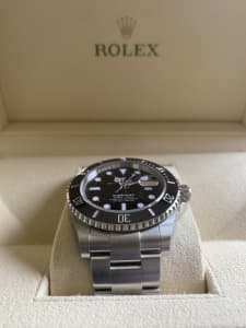 Rolex Submariner New with Box & Papers