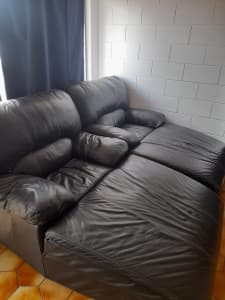 2 large cozy black leather lounges , easy to clean, perfect for movie 