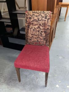 Royal red chair with brown wooden legs 