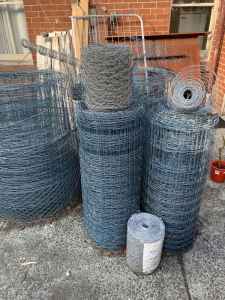 Heap of fencing gear - wire, copper logs, Cyclone gate & star pickets