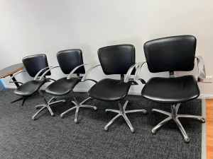 4 stainless steel faux leather chairs.