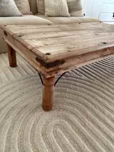 Beautiful Indian teak coffee table with iron detail.