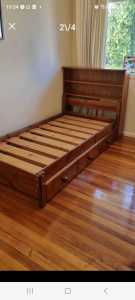Single bed ,solid oak with huge draws and Bookshelf on head