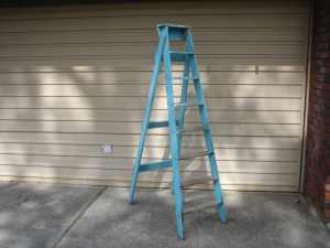 Large 8 foot wooden step ladder (damage to lower rungs)