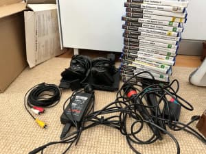 Playstation 2 with Singstar accessories, EyeToy camera and 20 games