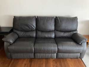 Leather sofa that has two recliners