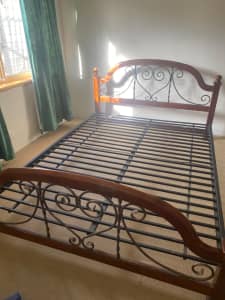 Solid timber and wrought iron bed frame