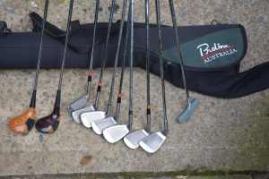 golf clubs and travel bag