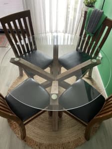 4 seater round glass table - table only, chairs not included.
