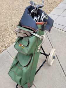 Set of golf clubs, bag and cart