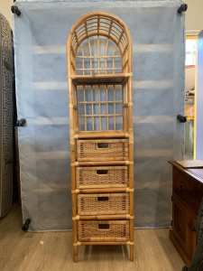 Lovely cane or rattan shelves with drawers