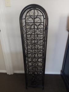 Ornate wrought-iron wine rack
